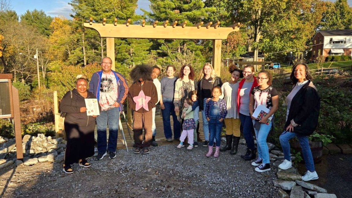 Group of children and adults standing at Tikkun Farm.
