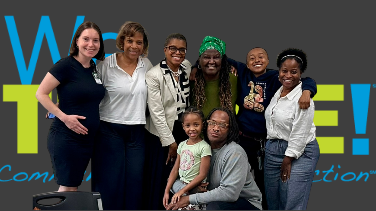 Members of the Woodlawn WeTHRIVE! team in front of a large WeTHRIVE! banner, with six adults standing behind a kneeling male and young child.