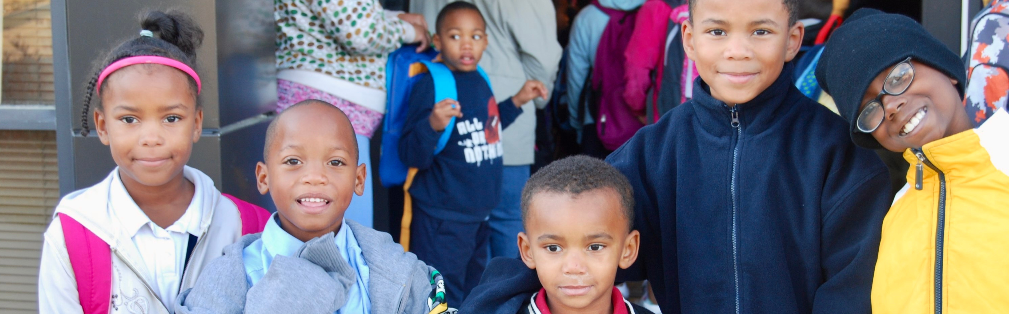 Schoolchildren smiling.